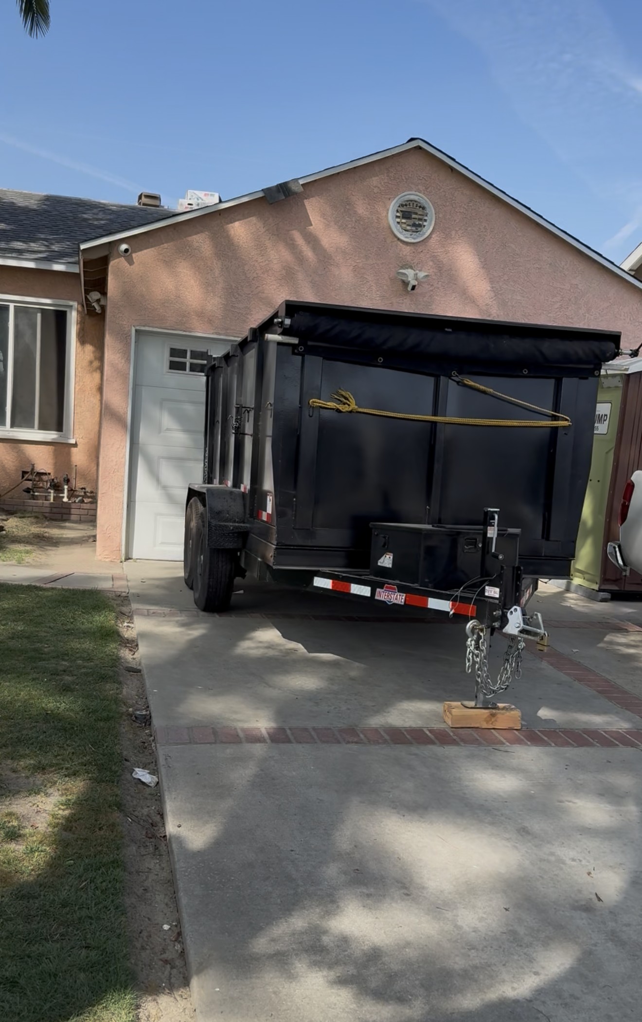 12-Yard Dumpster Trailer on Driveway